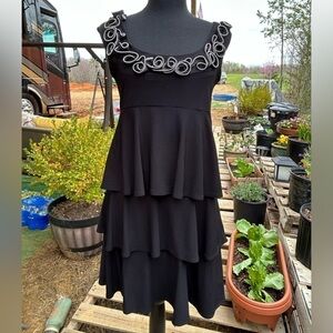 Tiana B. Dress with tiered skirt. Sleeveless. Size S. Black.